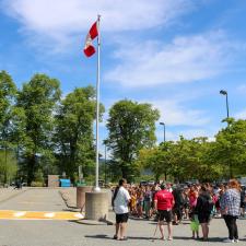 School community stands outside in front of new crosswalk 