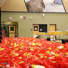 Over 200 food hampers sitting on the gym floor