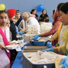 Students in line, receiving their food from the PAC